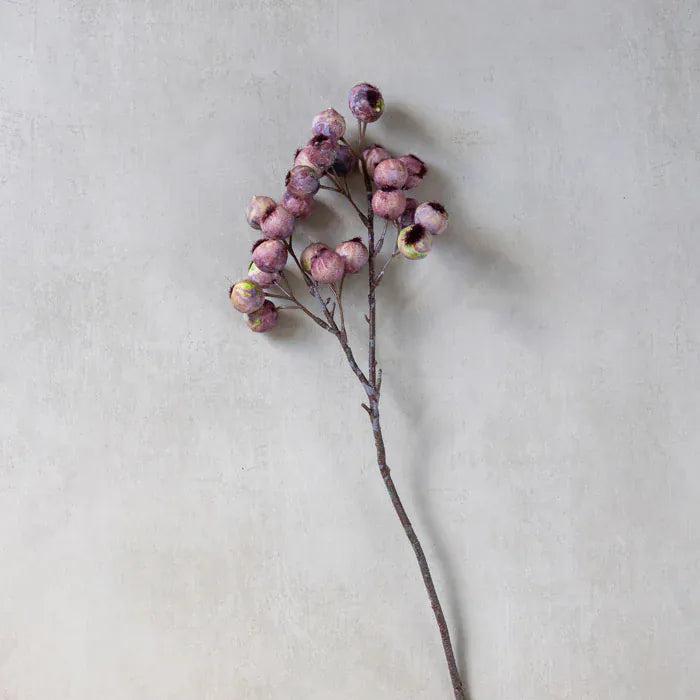 Single faux hawthorn berry stem with small purple-pink berries on a tall twig