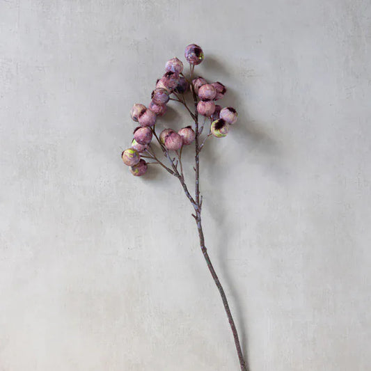 Single faux hawthorn berry stem with small purple-pink berries on a tall twig