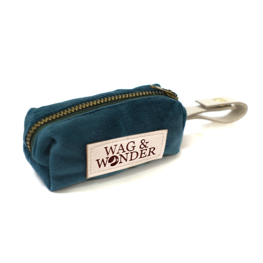 Teal velvet waste bag holder pouch with gold zipper and WAG & WONDER patch