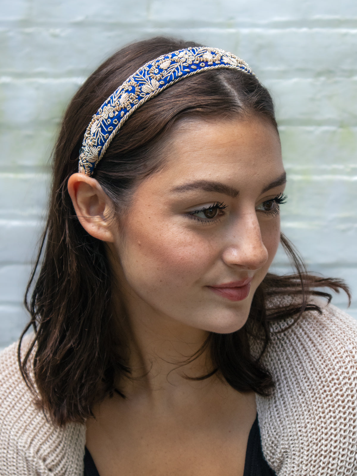 Blue Aurelia Filigree Headband with gold embroidery, shown worn from the side