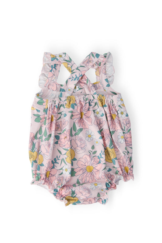 Pastel floral ruffle romper with elastic waist and cross-back shoulder detail