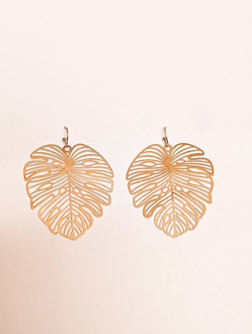 Gold leaf drop earrings, two leaf-shaped dangles with cutout vein line details
