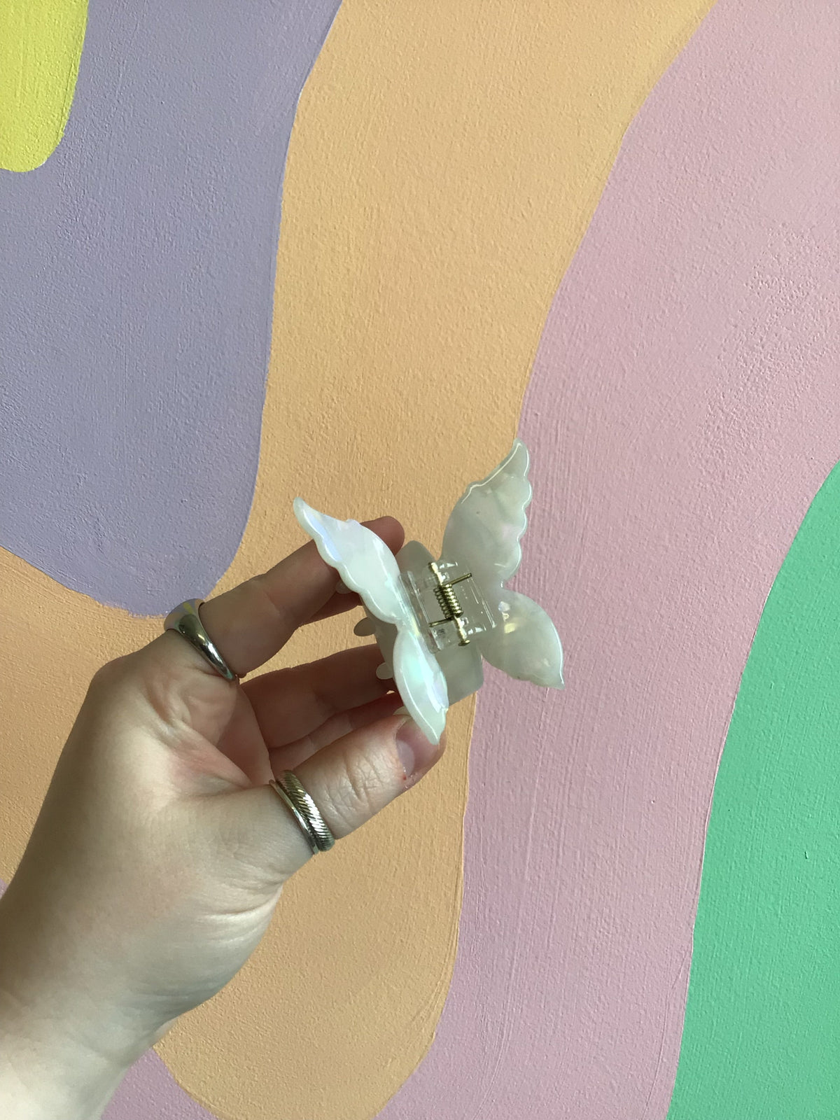 Butterfly hair claw with mint pale iridescent wings and metal hinged clip