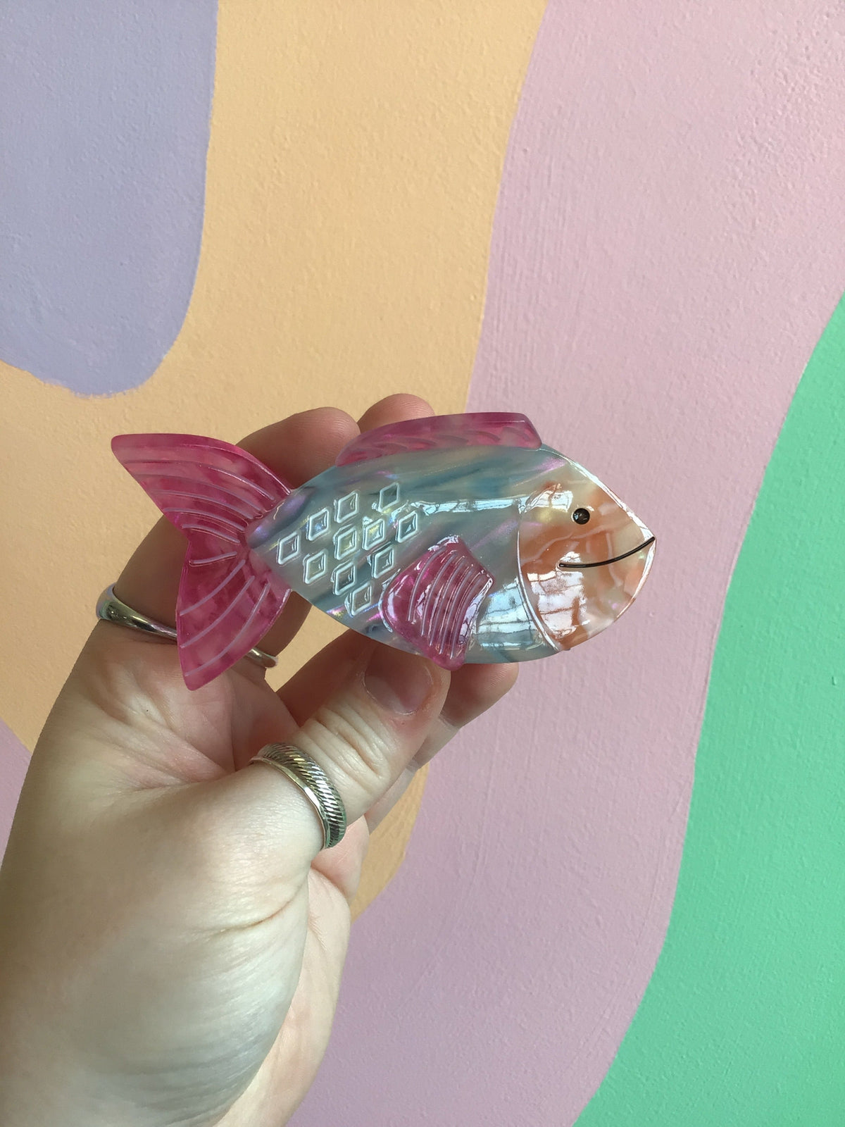Ocean-themed hair claw with silver scales and pink fins fish design