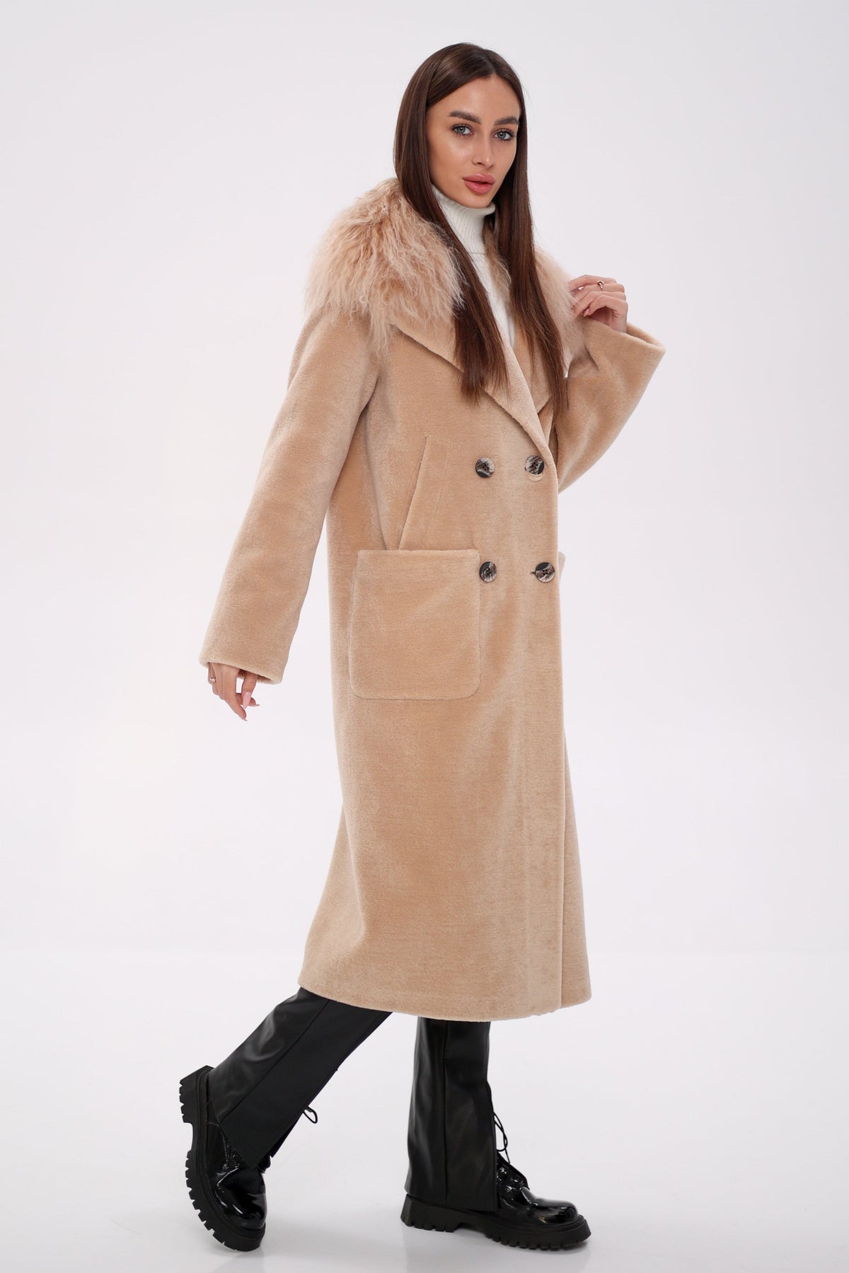 Side view of a beige long coat with fur collar, buttons, and large pockets