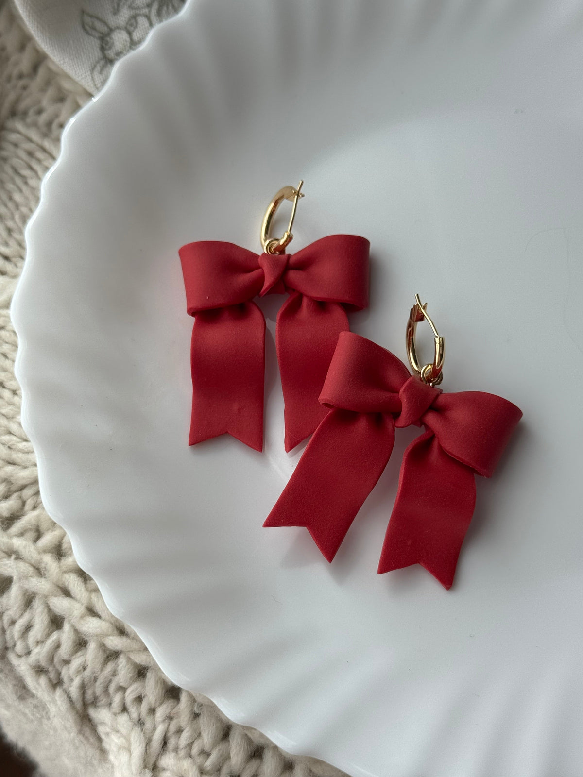 Red ribbon bow earrings with gold hoop hooks