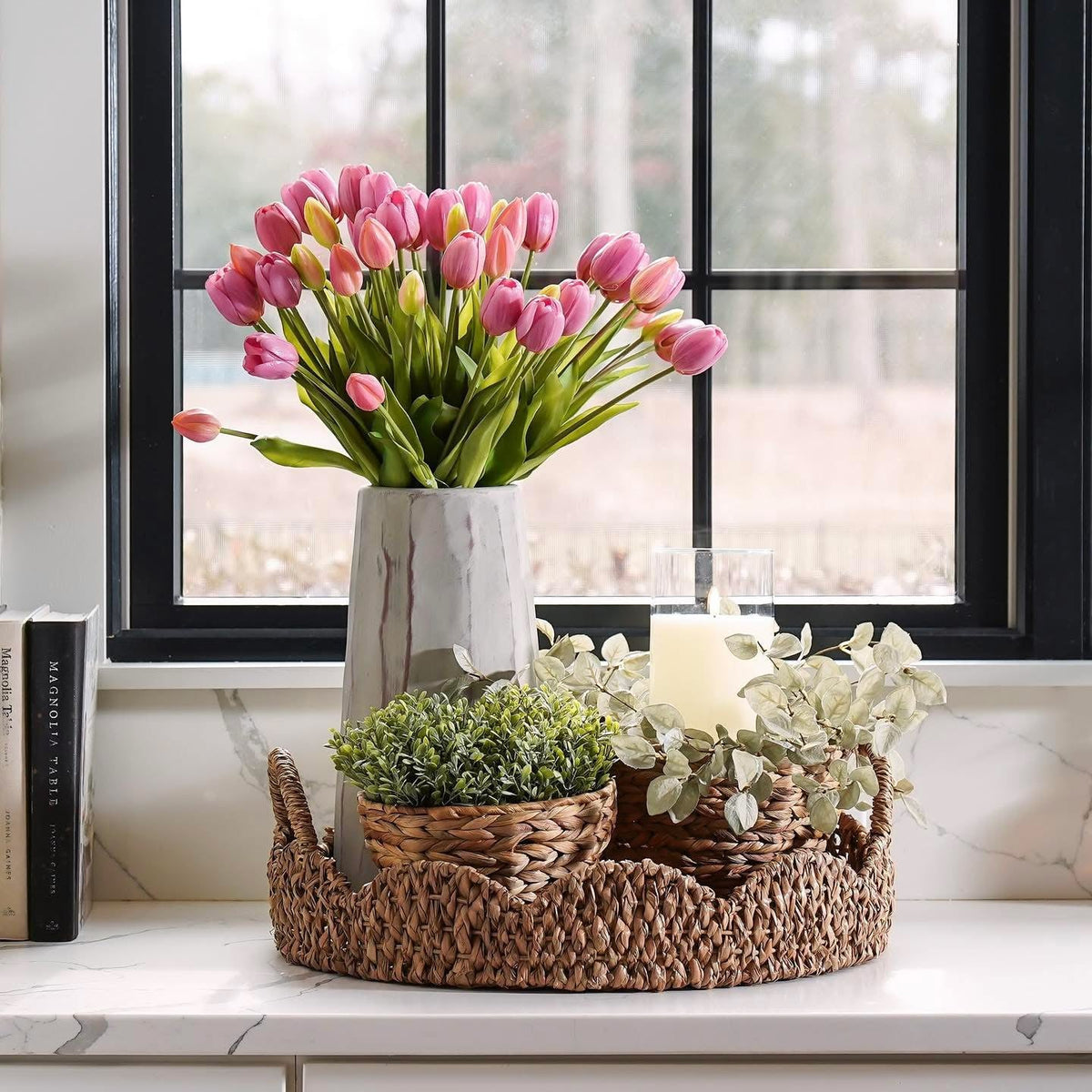 Pink tulip bouquet with green stems in a woven basket planter