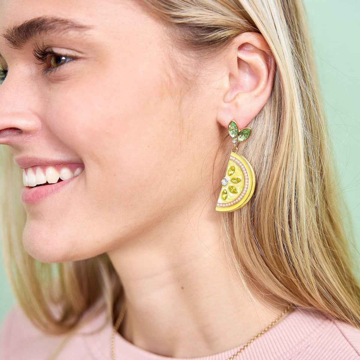 Lemon slice drop earrings with green leaf top, yellow center, and gold crystal accents