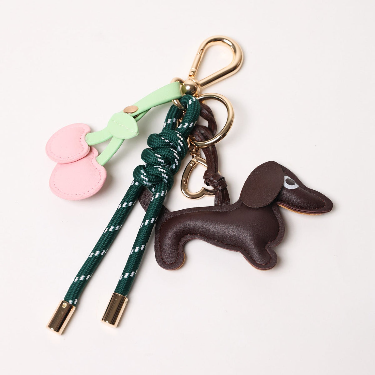 Emerald green key chain with brown dog charm and pink heart cherry charms