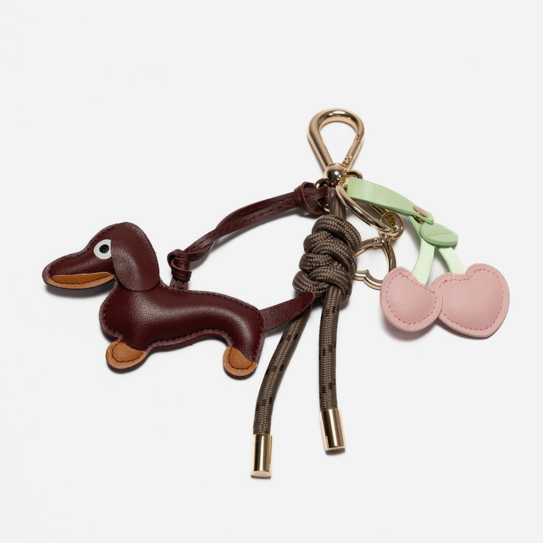 Mocha dog key chain with pink heart cherries and faux leather strap, gold accents