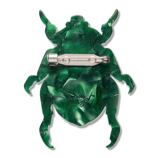 Green beetle brooch with silver pin clasp and flat metal backing