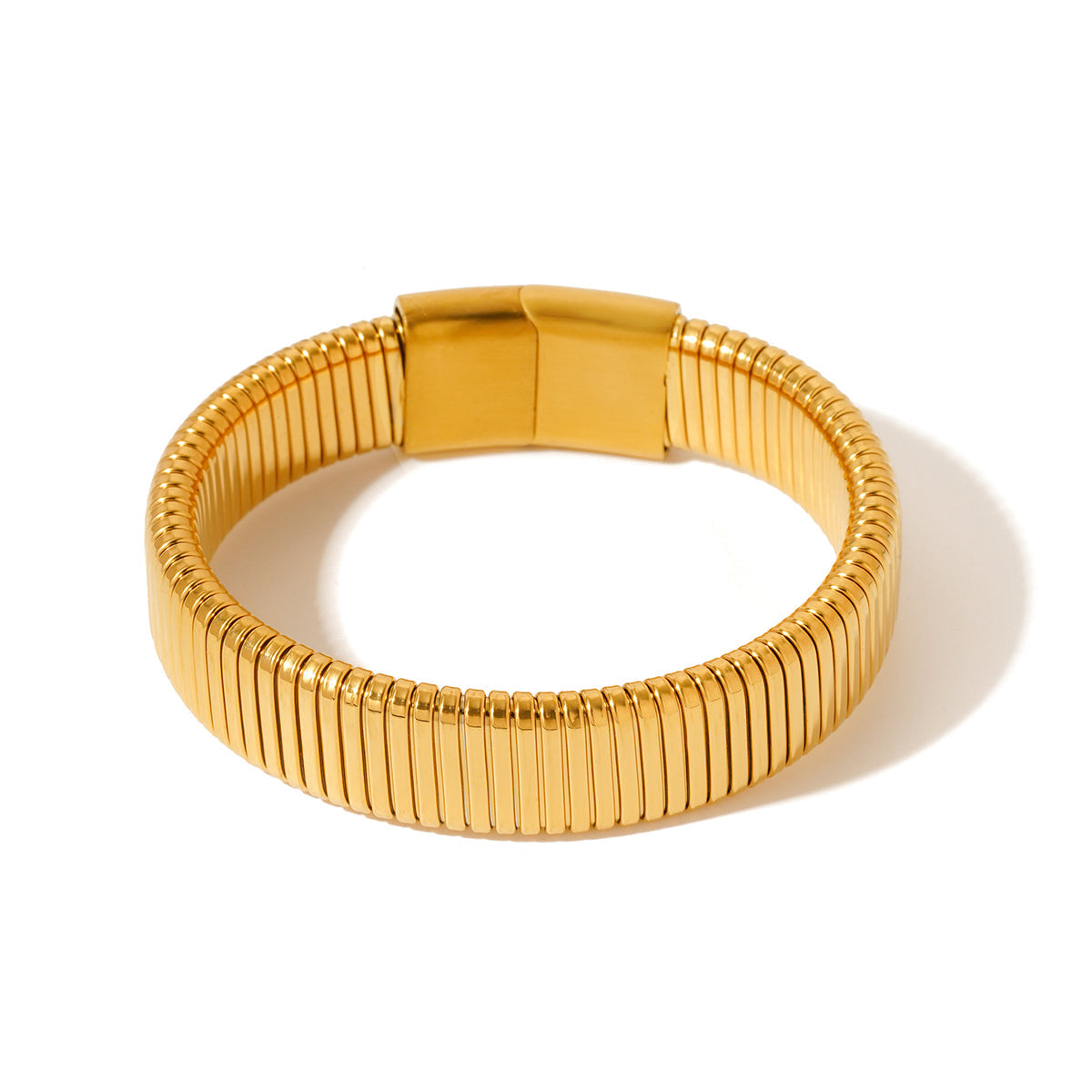 Gold ribbed chunky bangle bracelet with hinged clasp
