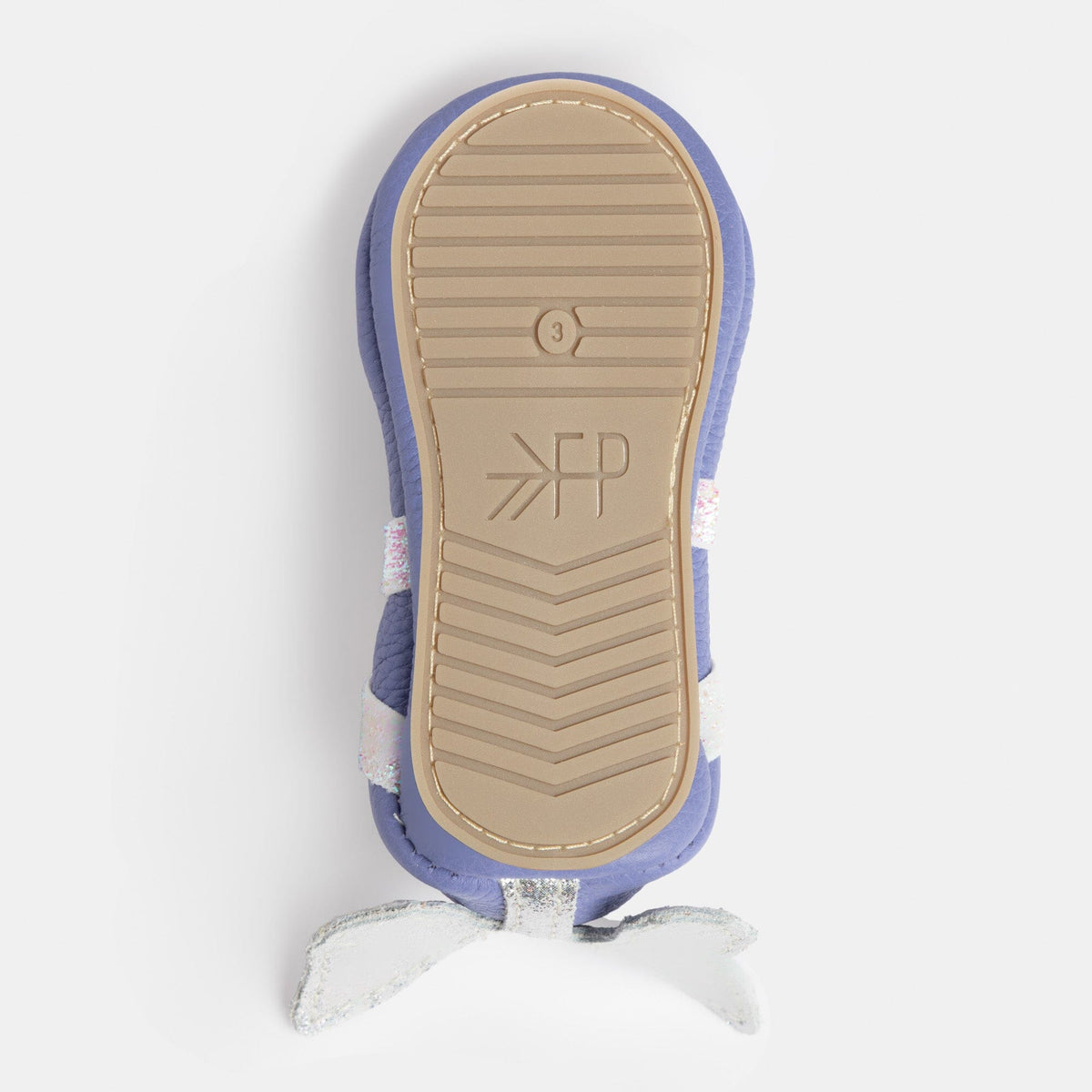 Sole of lilac baby ballet slipper with textured grip tread and hanging butterfly bow