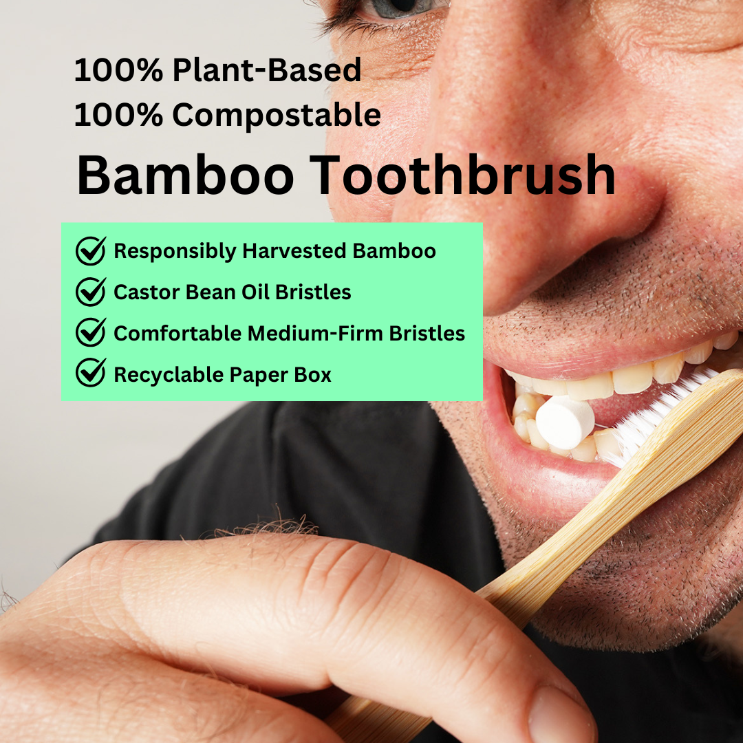 Bamboo toothbrush in use, showing its natural handle and white bristles