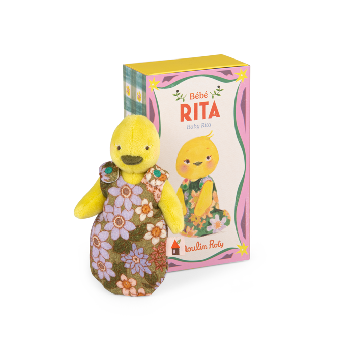 Yellow duck plush in a floral dress beside its illustrated product box