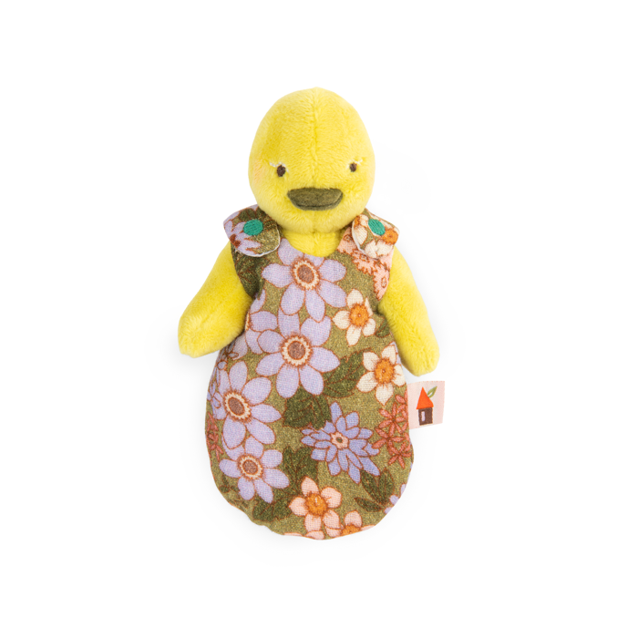 Yellow duck plush wearing a green dress with large floral patterns