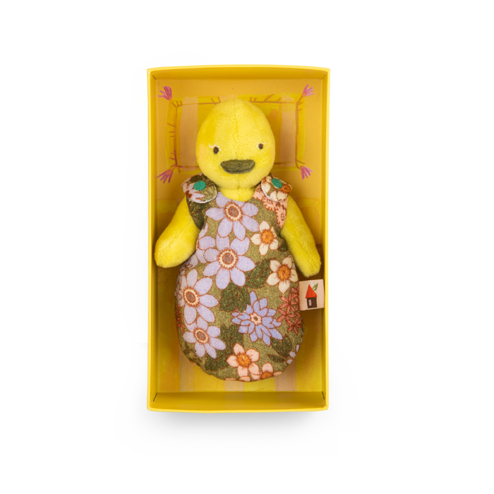 Yellow duck plush toy in a floral dress, displayed in a yellow box