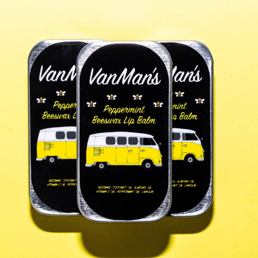 Peppermint beeswax lip balm tins with yellow bus graphic, three-pack view