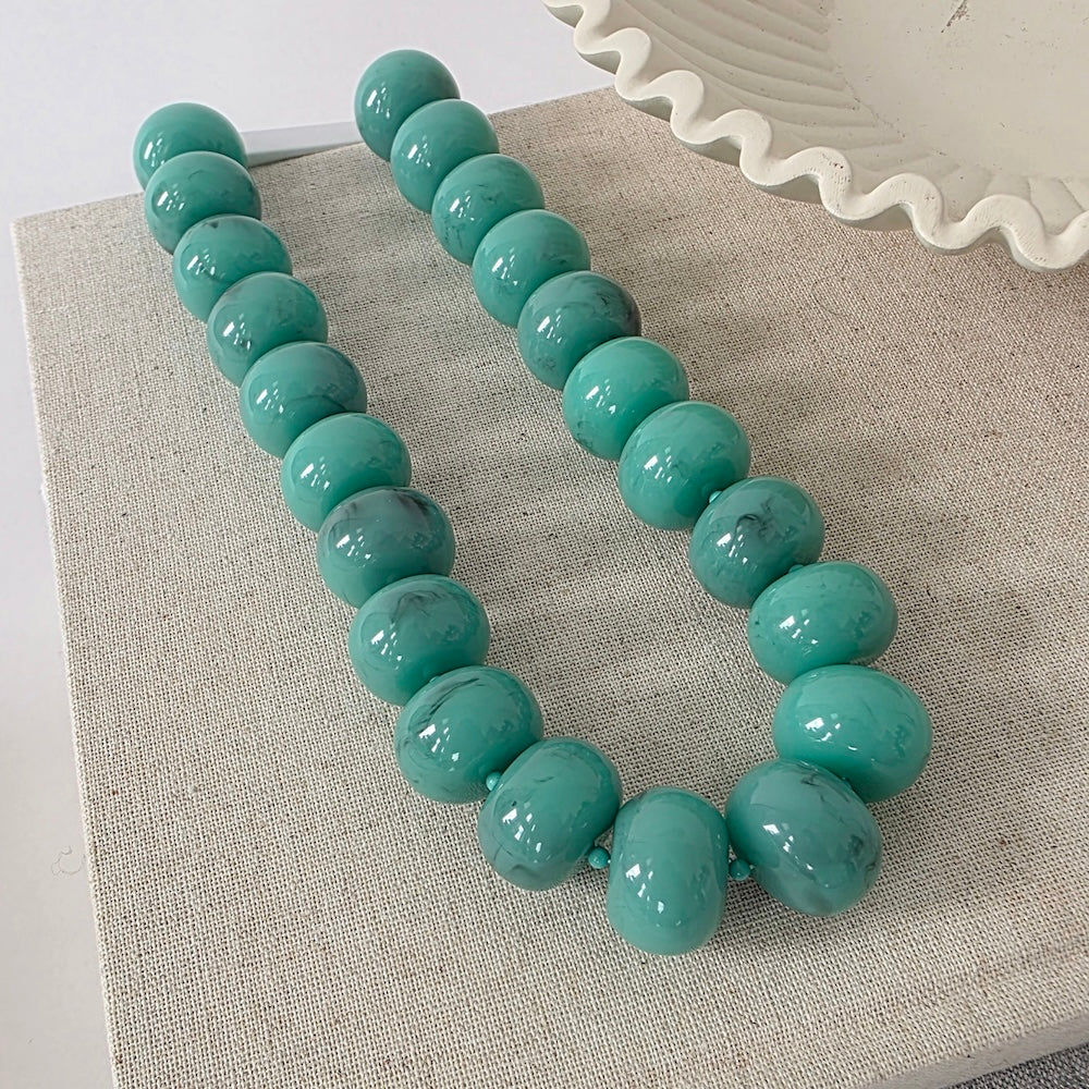 Teal beaded necklace with round bead strands
