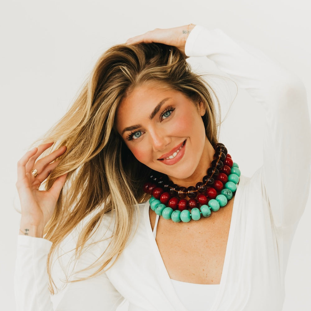 Beaded necklace with turquoise, dark brown, and red chunky round beads