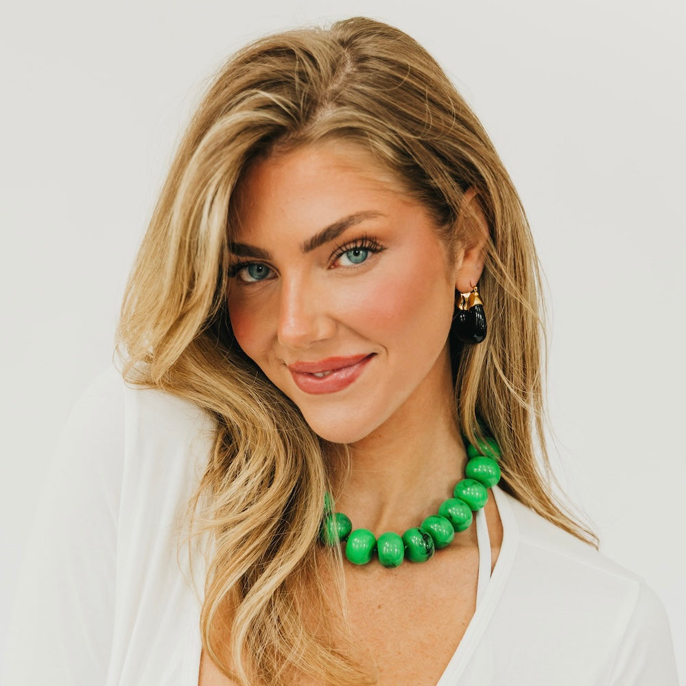 Green beaded necklace with chunky round beads and gold-tone tassel earring set