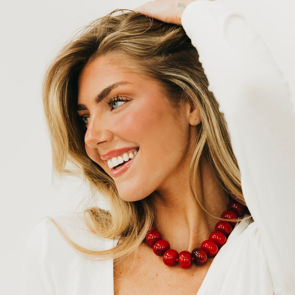 Red beaded necklace with chunky round beads and layered double strand design