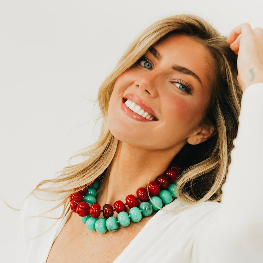 Beaded necklace with red and turquoise chunky round beads in layered rows