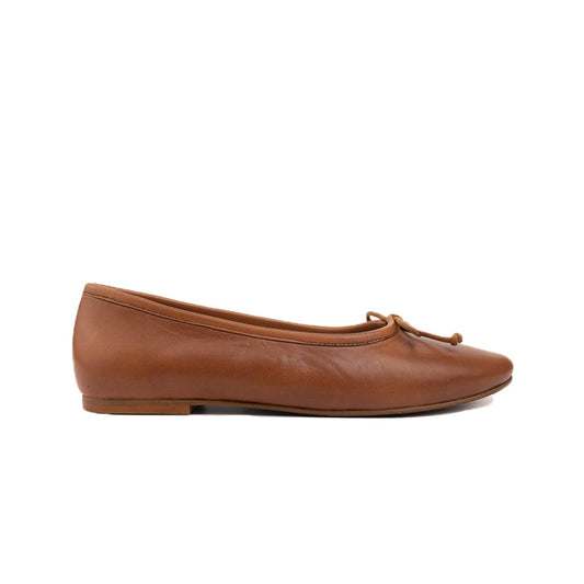 Tan leather ballet flat with a low heel and delicate bow, shown from the side.