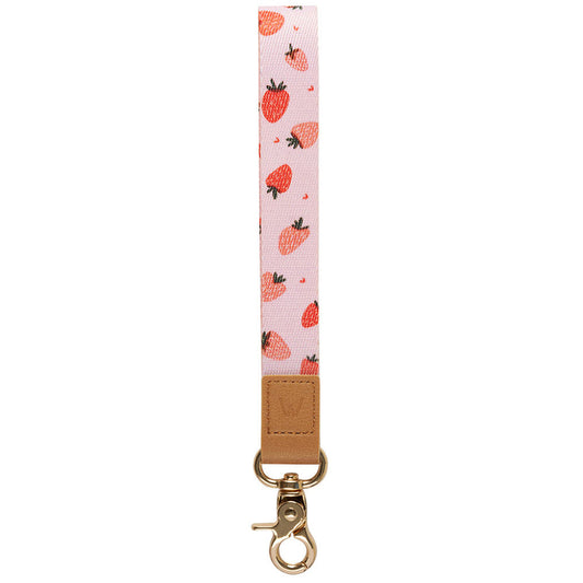 Strawberry-pattern wrist lanyard with tan leather patch and gold metal phone clip