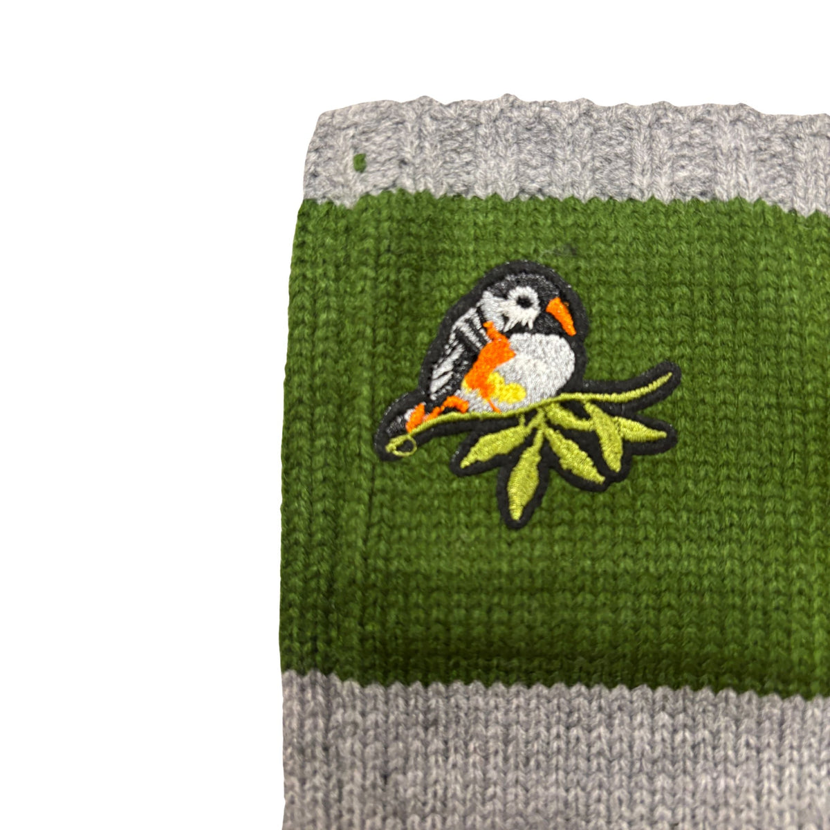 Green knitted arm warmer with bird applique embroidery and gray ribbed edge