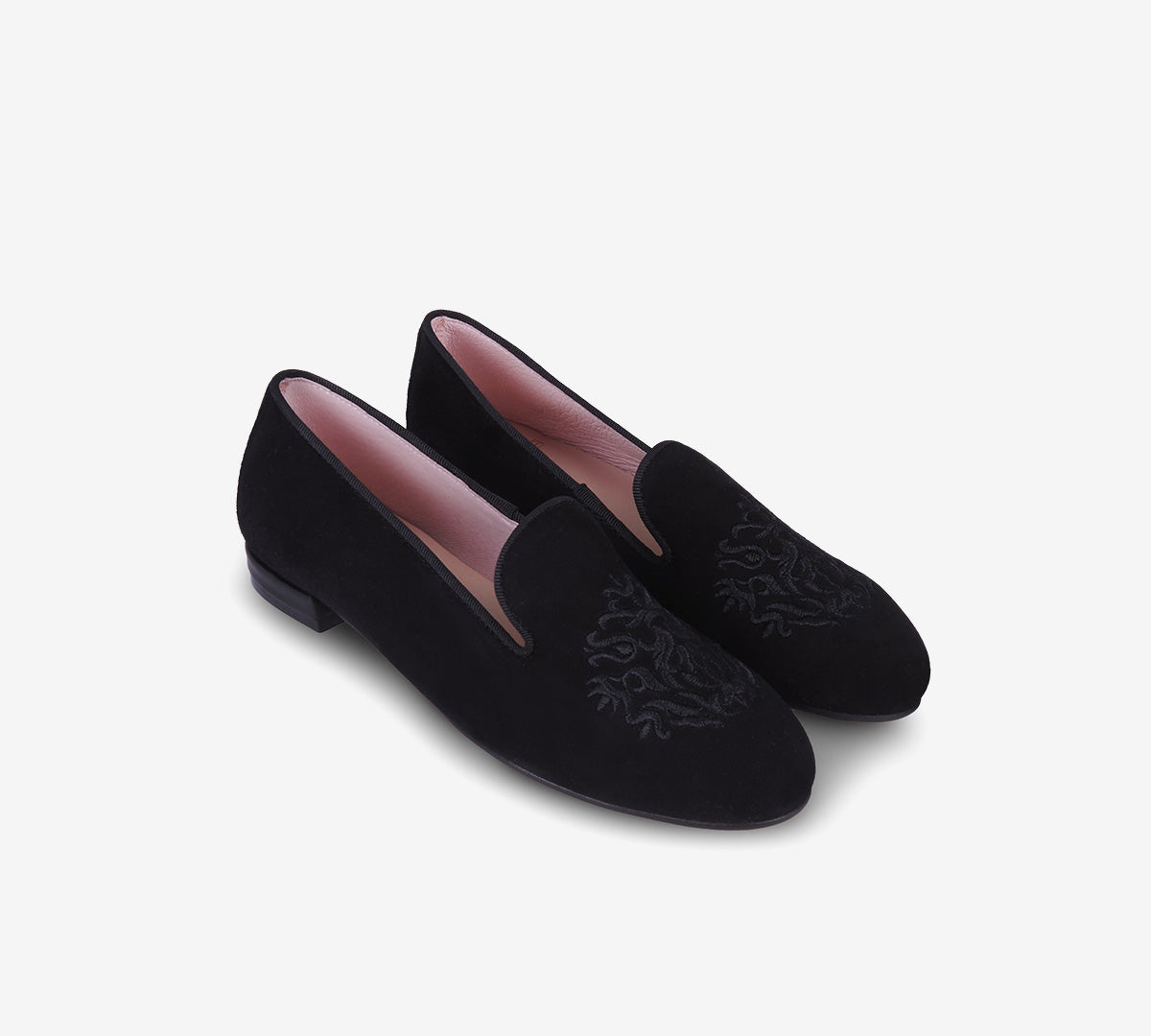 Pair of black loafers with embroidered crests, low heels and pink linings