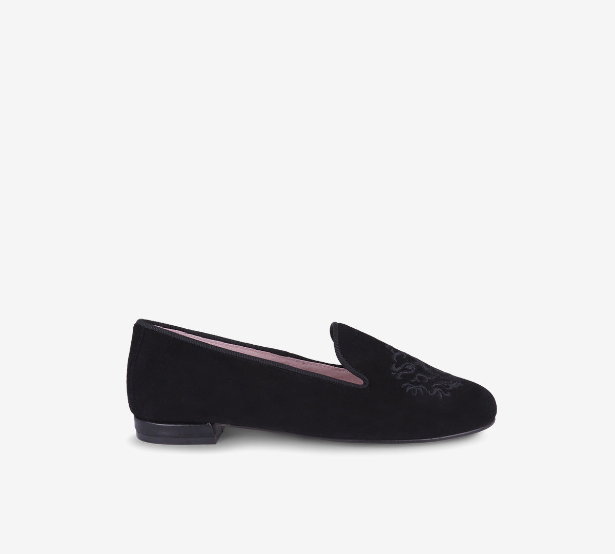 Black loafer with embroidered crest, low heel and pink lining, shown in side profile