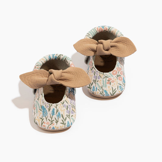 Baby floral baby shoes with knotted bow and tan fabric cuffs