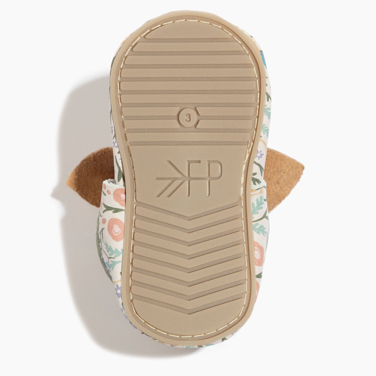 Baby shoe outsole bottom view with embossed ZFP and tan grip lines