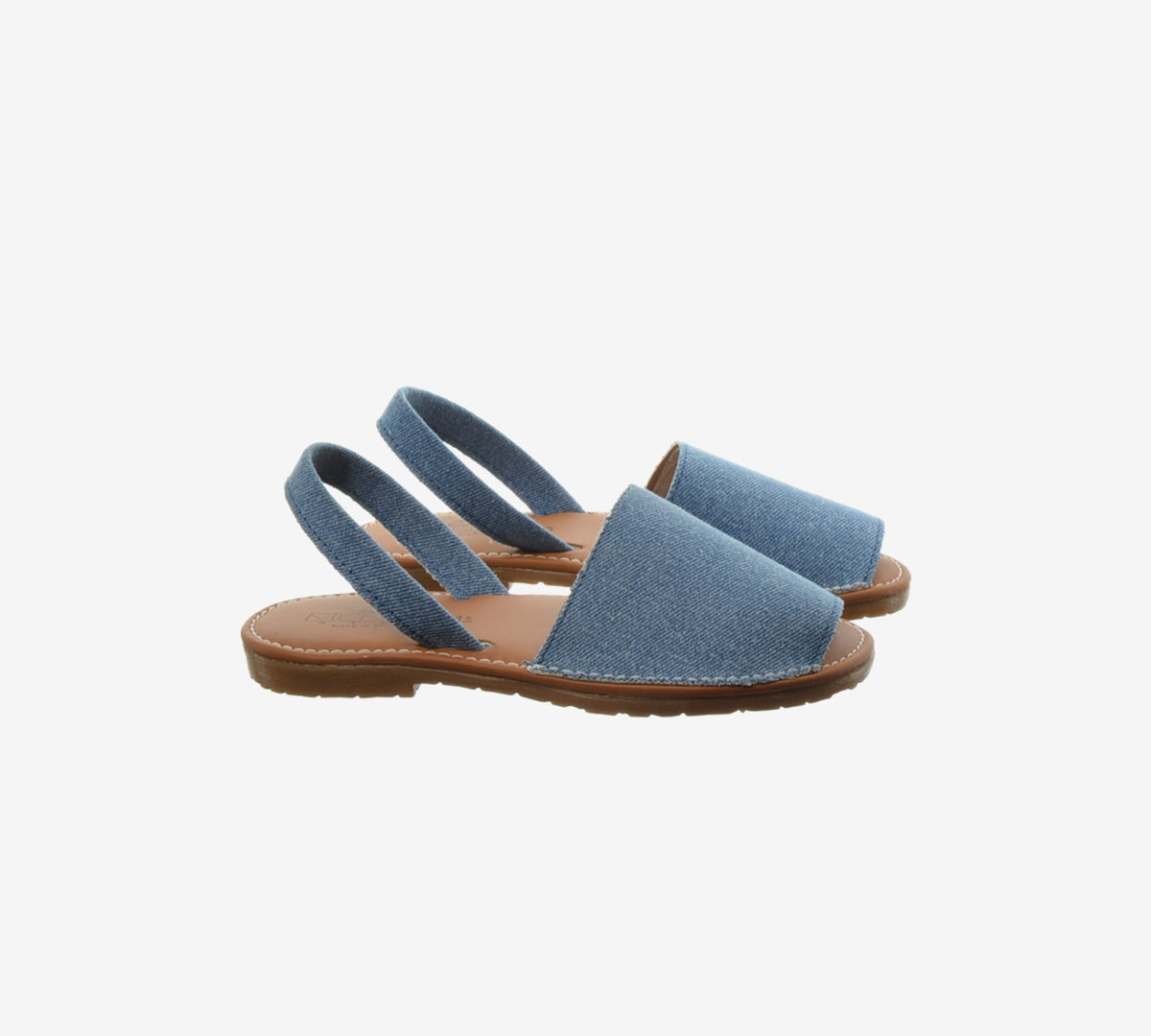 Pair of blue denim Menorcan sandals with wide toe straps and brown flat soles.