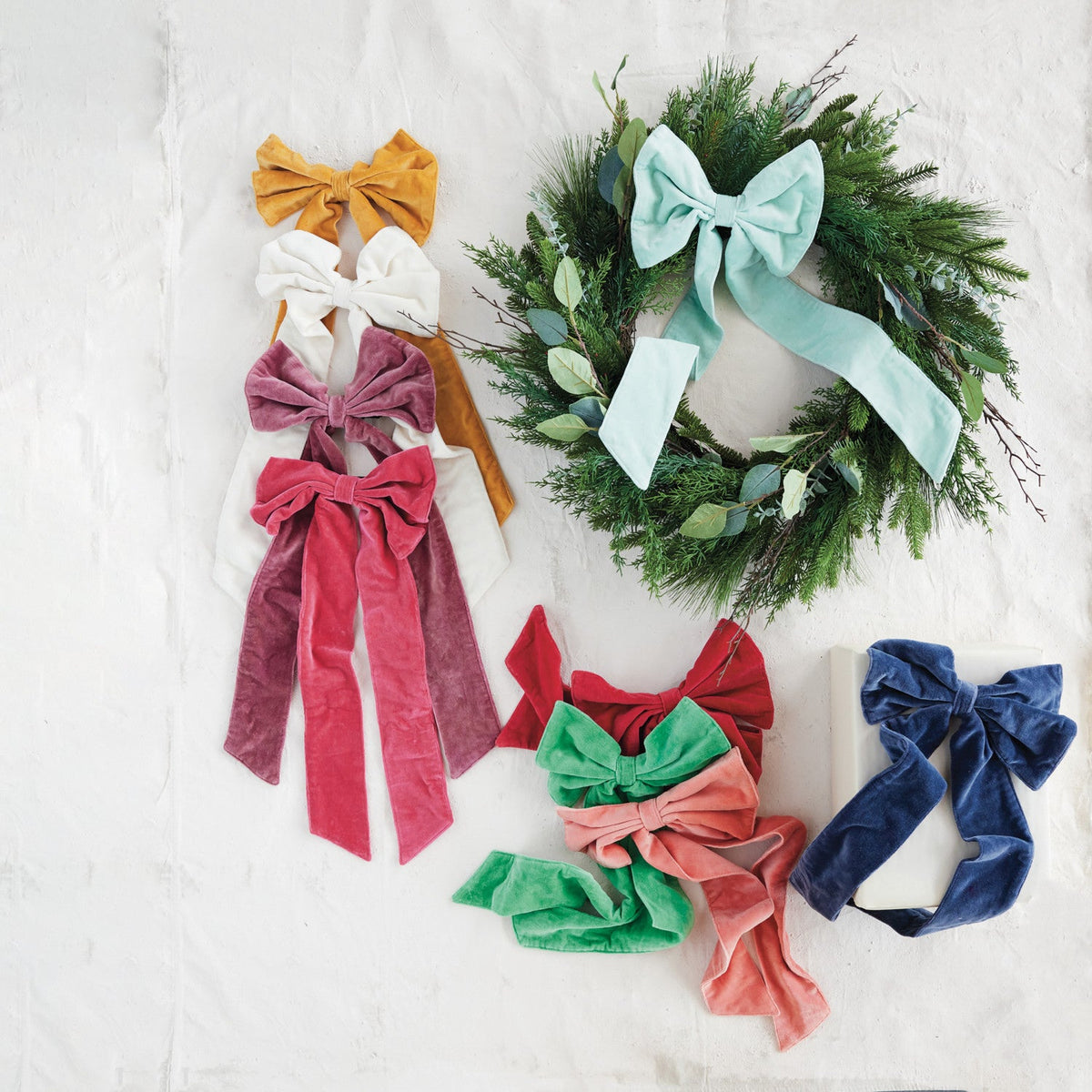 Navy cotton velvet bow among assorted holiday bows