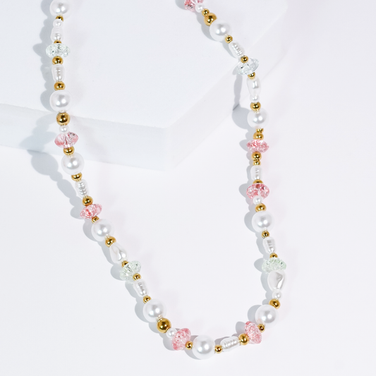 Pearl and blush bead necklace with gold-toned spacers, pink floral-style bead accents