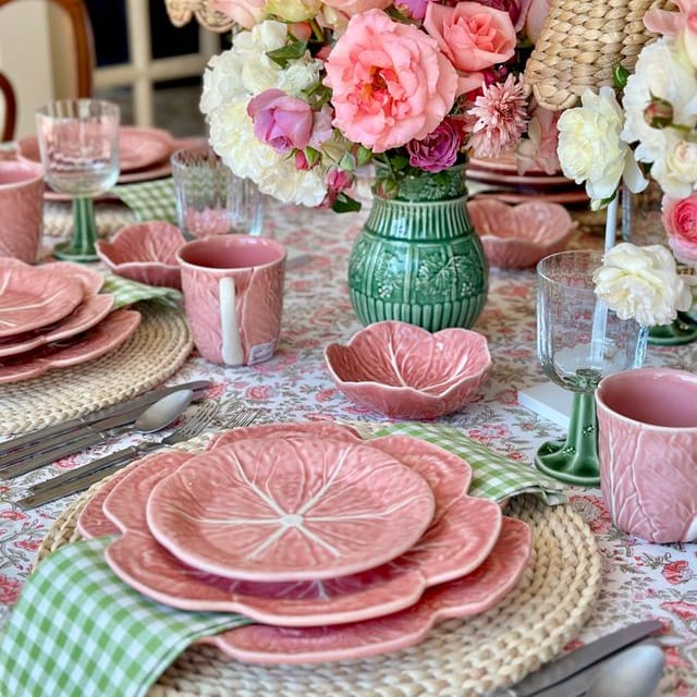 Set of four pink cabbage-shaped bowls with scalloped rim details.