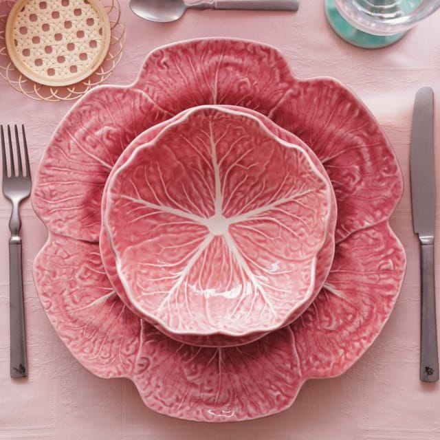 Pink ceramic cabbage-leaf salad bowl set with embossed leaf-vein pattern, top bowl front