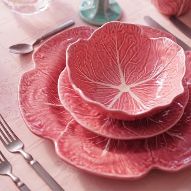 Pink ceramic cabbage-leaf salad bowl with embossed leaf veins and scalloped rim