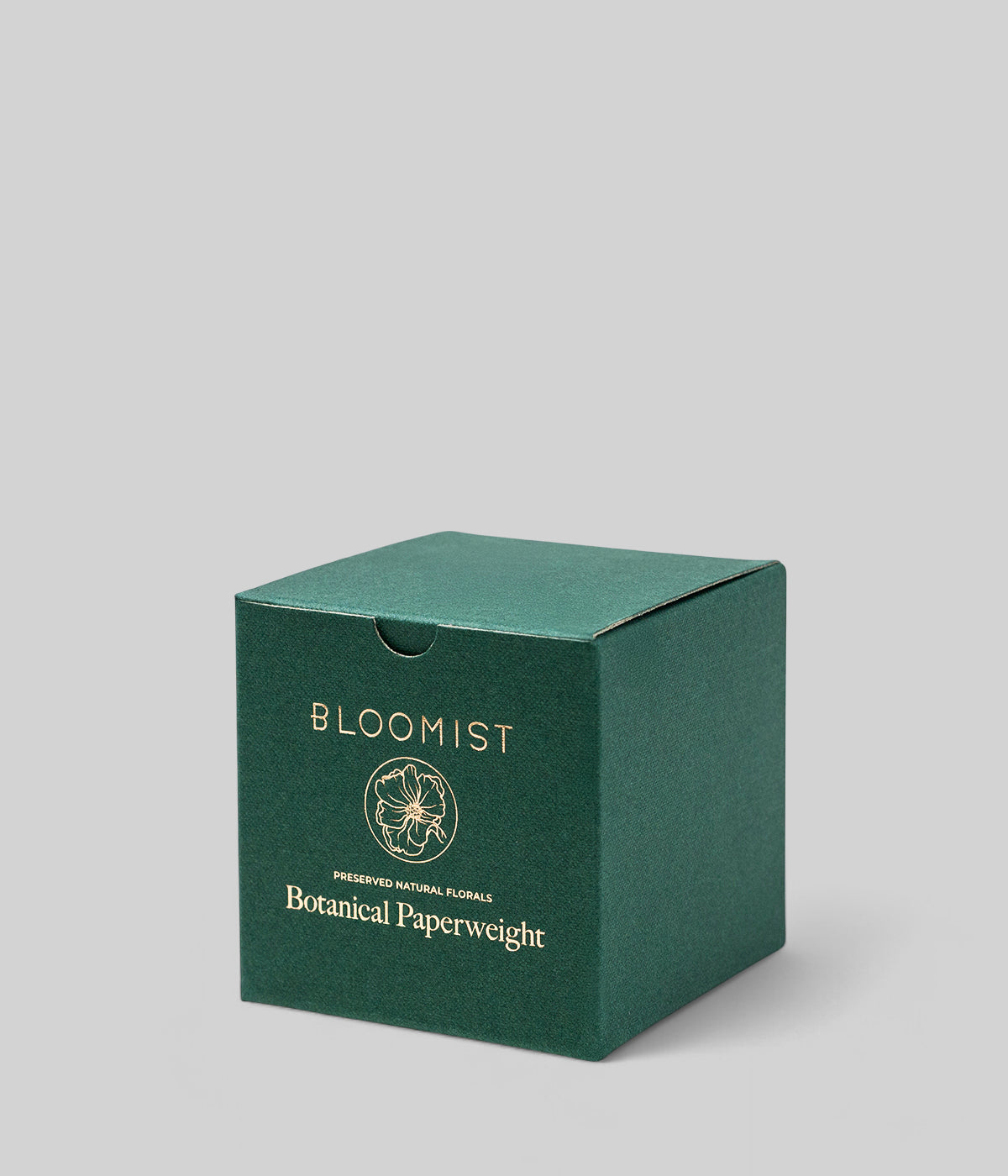 Green botanical gift box with Bloomist logo and paperweight text