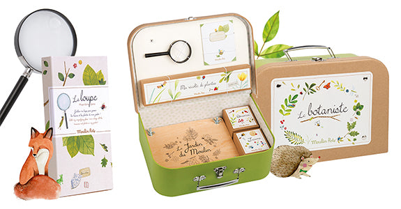 Botanical suitcase with handle, illustrated cards, magnifier, and fox figurine