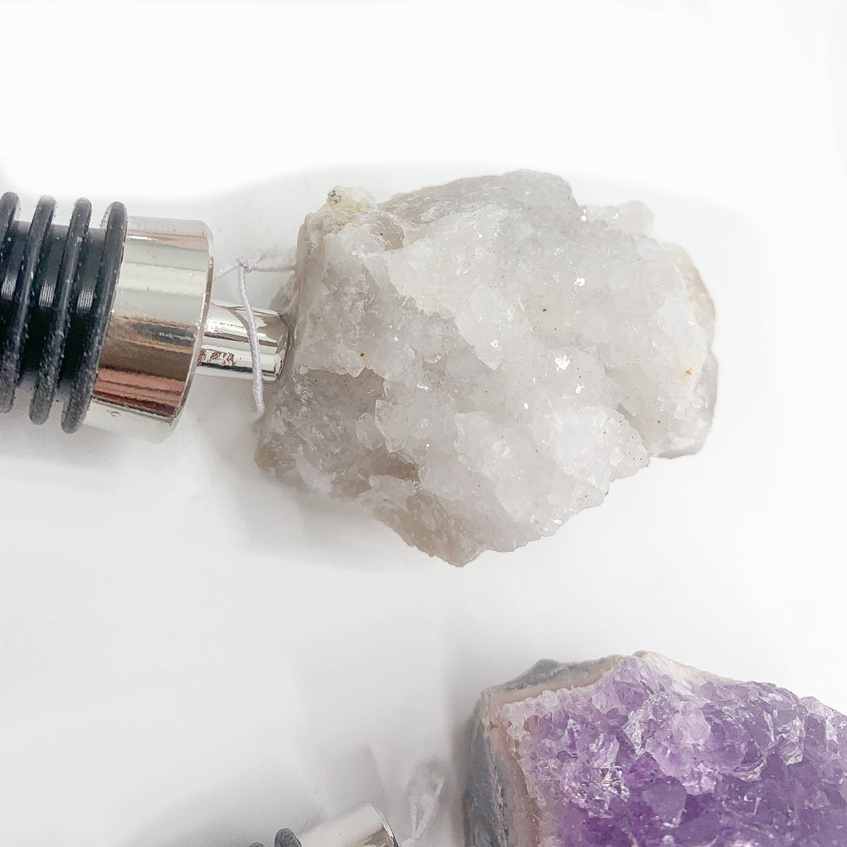Naturally Bougie crystal bottle stopper with silver cone tip and dark ribbed gasket