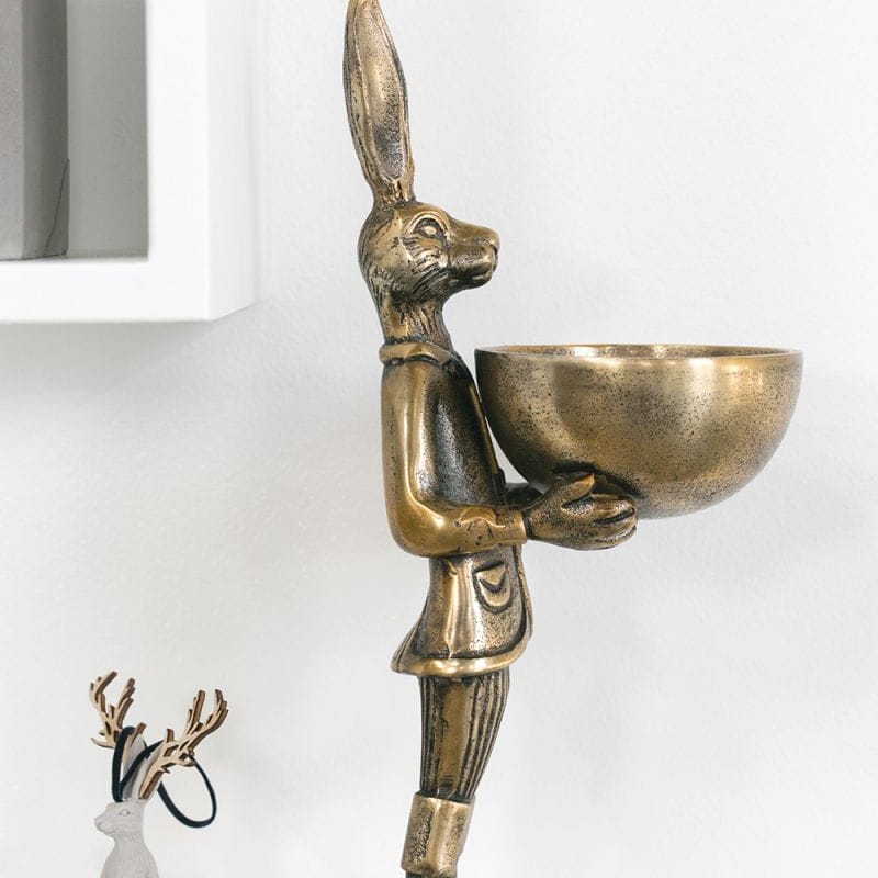 Brass gold hare candle holder with standing figure holding a round bowl