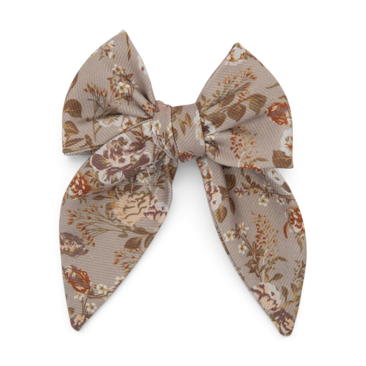 Floral print hair bow in tan fabric with layered loops and center knot