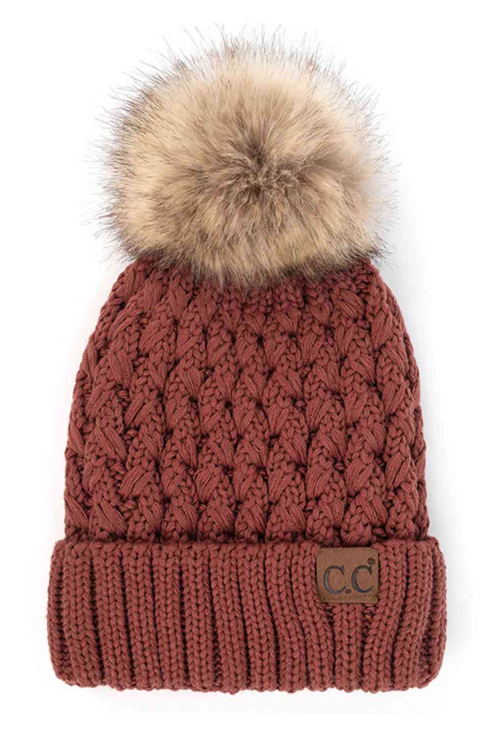 Knit beanie with pom-pom, rust cable knit, ribbed cuff and C.C. label patch