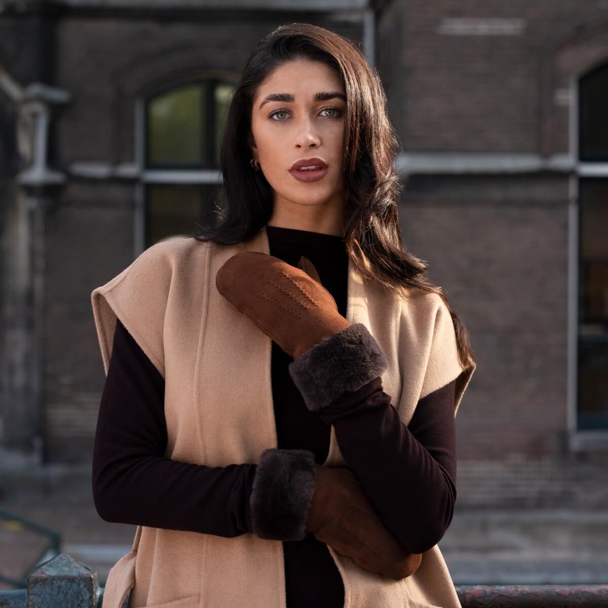 Brown suede mittens with dark fur cuff, open mitten and thumb seam view