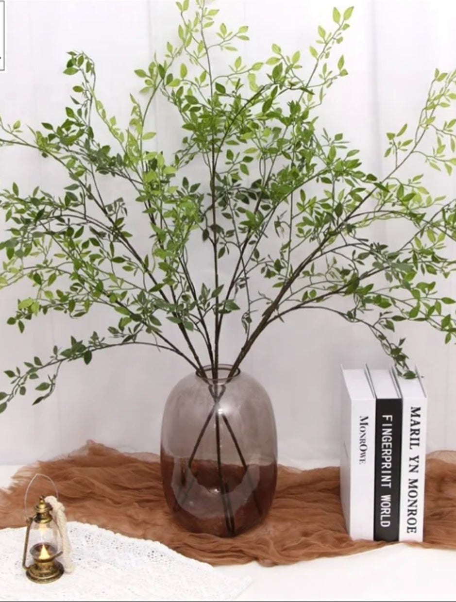 Artificial ruscus stems bundle, green leafy branches with stems gathered for vases