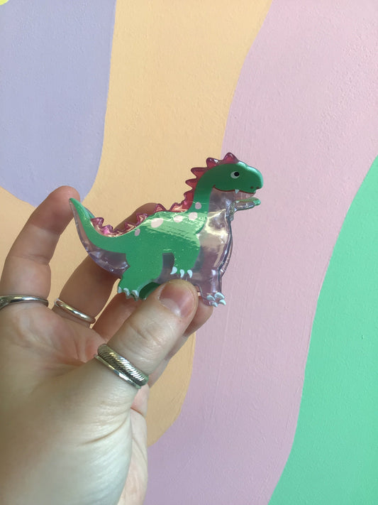 Green dinosaur hair claw with clear acrylic claws, small teeth detail