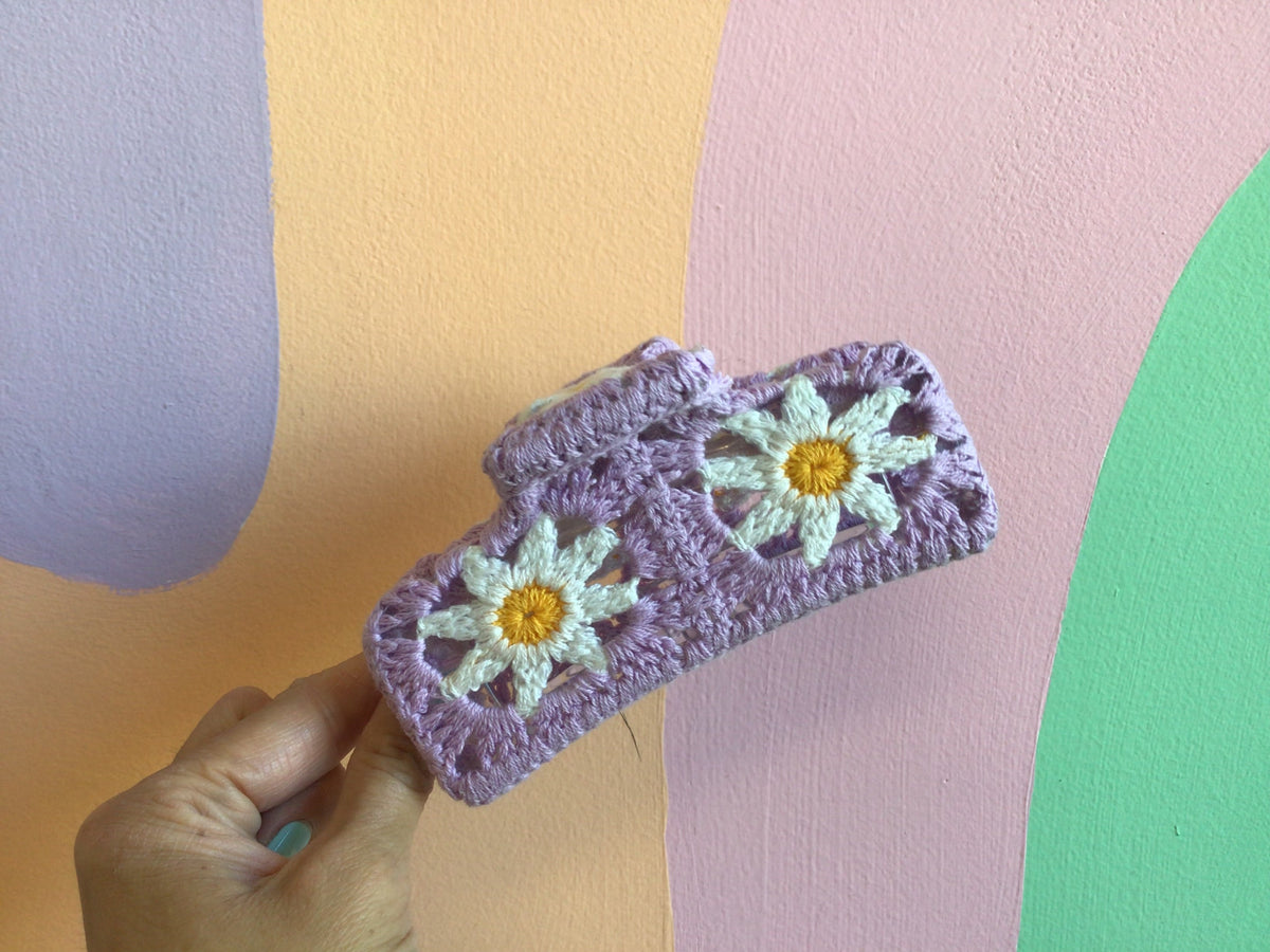 Crocheted hair claw in lavender with yellow daisy appliques